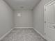 Empty basement room with gray carpet and neutral walls at 5732 Cypress Bluff Ln, Hoschton, GA 30548