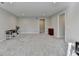 Spacious basement with neutral-toned walls and gray carpeting at 5732 Cypress Bluff Ln, Hoschton, GA 30548