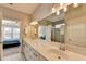 Elegant bathroom with double vanity and large mirror at 5732 Cypress Bluff Ln, Hoschton, GA 30548