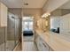 Modern bathroom with a glass shower and gray tile at 5732 Cypress Bluff Ln, Hoschton, GA 30548