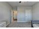 Well-lit bedroom with carpet and ceiling fan at 5732 Cypress Bluff Ln, Hoschton, GA 30548