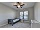 Bright bedroom with a twin bed and large window at 5732 Cypress Bluff Ln, Hoschton, GA 30548