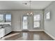 Bright dining room features hardwood floors, neutral walls, and access to a deck at 5732 Cypress Bluff Ln, Hoschton, GA 30548