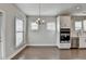 Bright dining room with hardwood floors and neutral walls at 5732 Cypress Bluff Ln, Hoschton, GA 30548