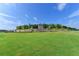 Community entrance with stone details and landscaping at 5732 Cypress Bluff Ln, Hoschton, GA 30548