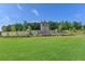 Community entrance with stone details and landscaping at 5732 Cypress Bluff Ln, Hoschton, GA 30548