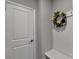 Inviting entryway with coat hooks and decorative wreath at 5732 Cypress Bluff Ln, Hoschton, GA 30548