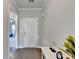 Bright foyer with hardwood floors and view into the living room at 5732 Cypress Bluff Ln, Hoschton, GA 30548
