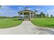 Charming gazebo with a grassy lawn and walking path at 5732 Cypress Bluff Ln, Hoschton, GA 30548