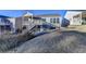 House back view, showcasing a deck, stairs, and fenced yard at 5732 Cypress Bluff Ln, Hoschton, GA 30548