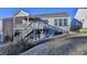 House back view, showcasing a deck, stairs, and fenced yard at 5732 Cypress Bluff Ln, Hoschton, GA 30548