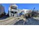 Two-story house with a deck, stairs, and fenced yard at 5732 Cypress Bluff Ln, Hoschton, GA 30548