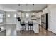 Modern kitchen with white cabinets, stainless steel appliances, and an island at 5732 Cypress Bluff Ln, Hoschton, GA 30548