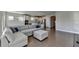 Spacious living room with hardwood floors and a large sectional sofa at 5732 Cypress Bluff Ln, Hoschton, GA 30548