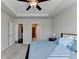 Main bedroom with carpeted floors and access to bathroom and walk-in closet at 5732 Cypress Bluff Ln, Hoschton, GA 30548