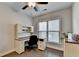 Home office with built-in desk and window with blinds at 5732 Cypress Bluff Ln, Hoschton, GA 30548