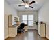 Home office with built-in desk and window with blinds at 5732 Cypress Bluff Ln, Hoschton, GA 30548