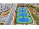 Community tennis courts with surrounding landscaping at 5732 Cypress Bluff Ln, Hoschton, GA 30548