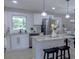 Modern kitchen with white shaker cabinets and granite countertops at 711 Old Tanyard Rd, Villa Rica, GA 30180