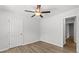 Well-lit bedroom with wood-look floors and ceiling fan at 7270 Crestside Dr, Austell, GA 30168