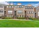 Brick front of charming townhome with manicured lawn at 1316 Harris Way, Brookhaven, GA 30319