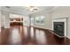 Living room with hardwood floors, fireplace and an open concept floor plan at 2156 Villa Spring Ct, Dacula, GA 30019