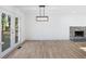 Open concept dining area with hardwood floors and French doors at 488 Village Run, Lawrenceville, GA 30046