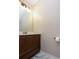 Small bathroom with dark brown vanity and marble floor at 1184 Red Oak Cv, Tucker, GA 30084