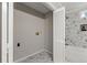 Convenient laundry room with marble shower and storage at 2987 Forest Chase Ne Ter, Marietta, GA 30066