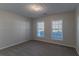 Simple bedroom with carpet and neutral wall color at 1987 Ridge Water Ln, Lawrenceville, GA 30045