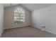 Bedroom with large arched window and carpeted floor at 1987 Ridge Water Ln, Lawrenceville, GA 30045
