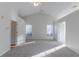 Spacious bedroom with carpeted floor, vaulted ceiling, and large windows at 1987 Ridge Water Ln, Lawrenceville, GA 30045