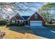 Brick home with attached garage and landscaped lawn at 1987 Ridge Water Ln, Lawrenceville, GA 30045