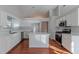 Eat-in kitchen with island, stainless steel appliances, and hardwood floors at 1987 Ridge Water Ln, Lawrenceville, GA 30045