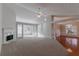 Open living room with fireplace and sunroom access at 1987 Ridge Water Ln, Lawrenceville, GA 30045