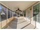 Relaxing screened porch with ceiling fan and access to backyard at 1987 Ridge Water Ln, Lawrenceville, GA 30045
