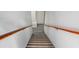 Basement stairs with wooden handrail at 250 Blackberry Ln, Douglasville, GA 30134