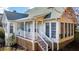 Sunroom with adjacent deck and stairs leading to the yard at 250 Blackberry Ln, Douglasville, GA 30134