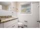 Bathroom with granite countertop and white tile at 763 Tara Se Cir, Atlanta, GA 30354