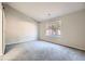 Large bedroom with gray walls, gray carpeting, and a barn door at 1954 Big Branch Ct, Lithonia, GA 30058