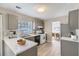 Modern kitchen with gray cabinets, stainless steel appliances, and an island at 1954 Big Branch Ct, Lithonia, GA 30058