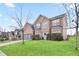 Front view of a two-story brick home with a well-maintained lawn and landscaping at 4975 Burberry Way, Fairburn, GA 30213