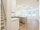 Modern kitchen with gray island, white cabinets, and stainless steel appliances at 695 Sunstone Ln, Lawrenceville, GA 30043