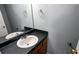 Bathroom with single sink and dark vanity at 9215 Green Side Path, Riverdale, GA 30274