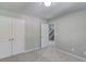 Spacious bedroom with double doors and access to stairs at 936 Turner Se Dr, Smyrna, GA 30080