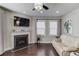 Living room features a fireplace, hardwood floors and neutral color palette at 936 Turner Se Dr, Smyrna, GA 30080