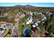 An aerial view showing the community and tennis court, with mountain views in the background at 260 Manning Sw Rd # 62, Marietta, GA 30064