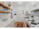 Bright eat-in kitchen with white cabinets, subway tile backsplash, and wood flooring at 260 Manning Sw Rd # 62, Marietta, GA 30064