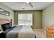 Bedroom with large window, ceiling fan, and dresser at 3285 Watson Gate Rd, Loganville, GA 30052