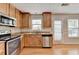 Updated kitchen featuring stainless steel appliances and granite countertops at 3285 Watson Gate Rd, Loganville, GA 30052